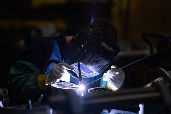Flagpole Installation in West Michigan 5 FlagCo welder TIG-welding aluminum flagpole hardware at the Acworth, Georgia facility