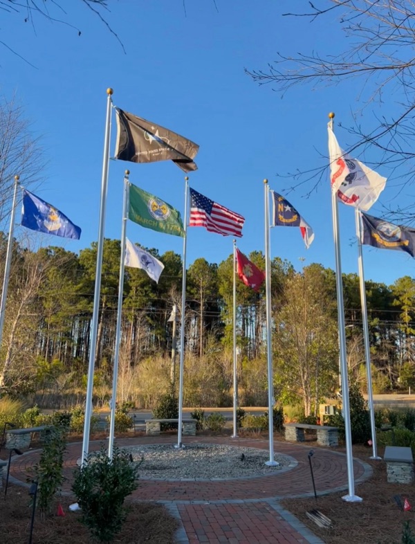 Flagpole Installation in Atlanta 2 Multiple FlagCo flagpoles flying service and organizational flags at a memorial plaza